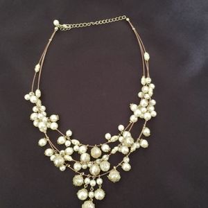Multi strand gold and pearl statement necklace